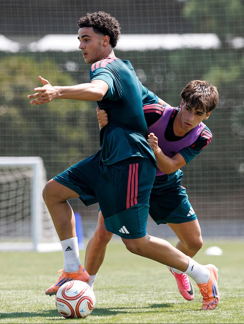 Young footballers training on the pitch
