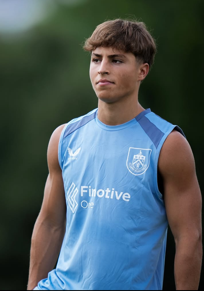 Young footballer in club training kit